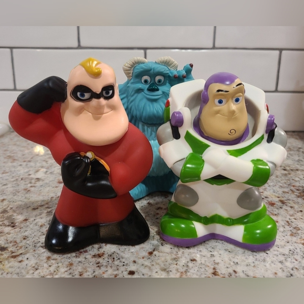 Set of three Pixar squeaky figures, Mr. Incredible, Sully and Buzz Lightyear